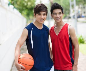 two teen boys with basketball